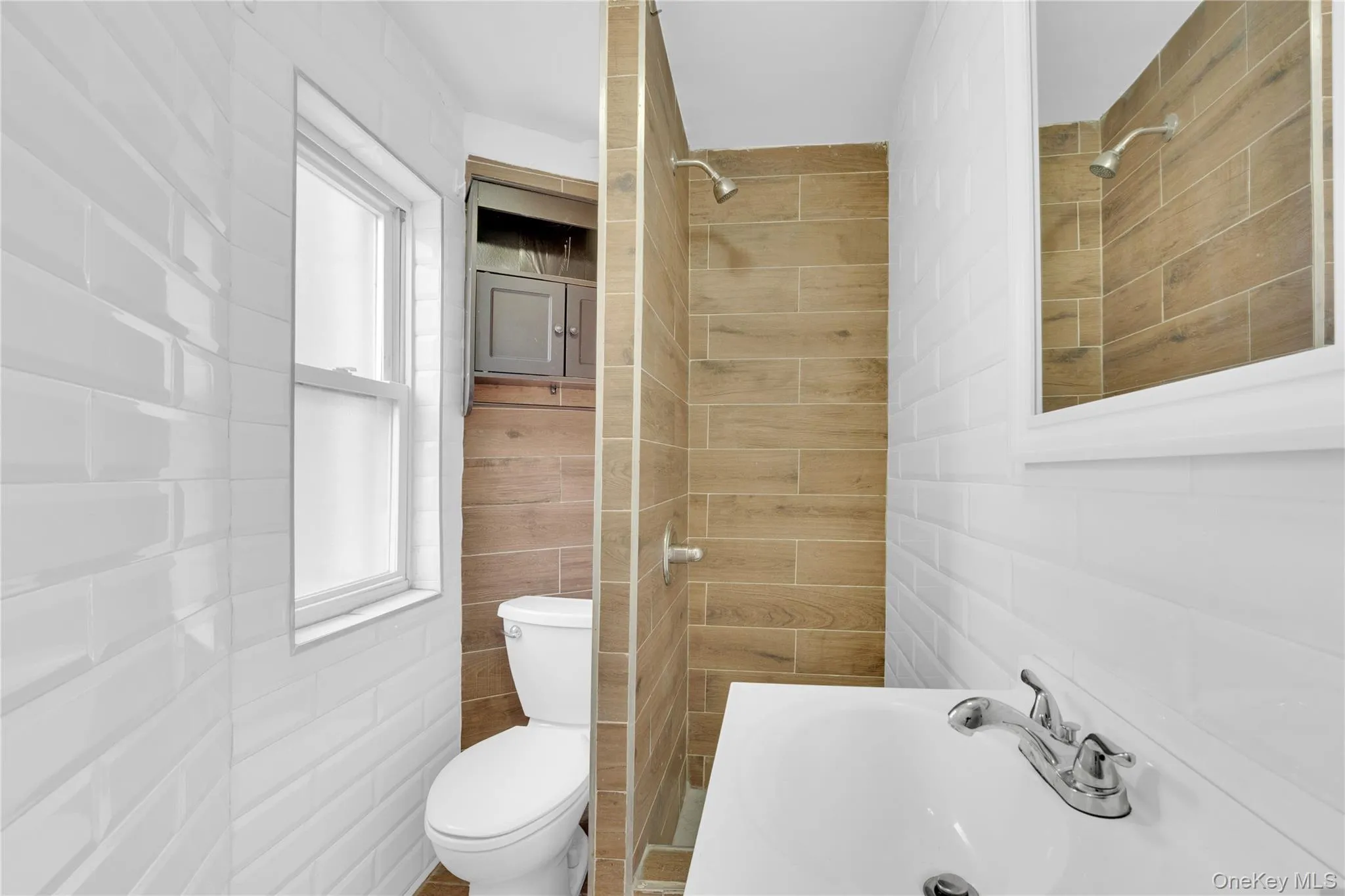 Bathroom with a stall shower and toilet Bathroom with a stall shower and toilet