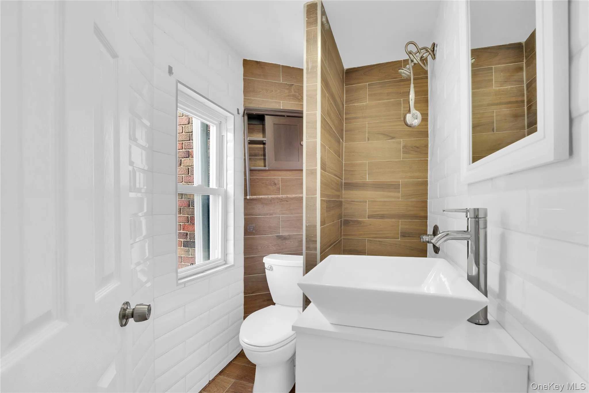 Bathroom with vanity and tile walls Bathroom with vanity and tile walls