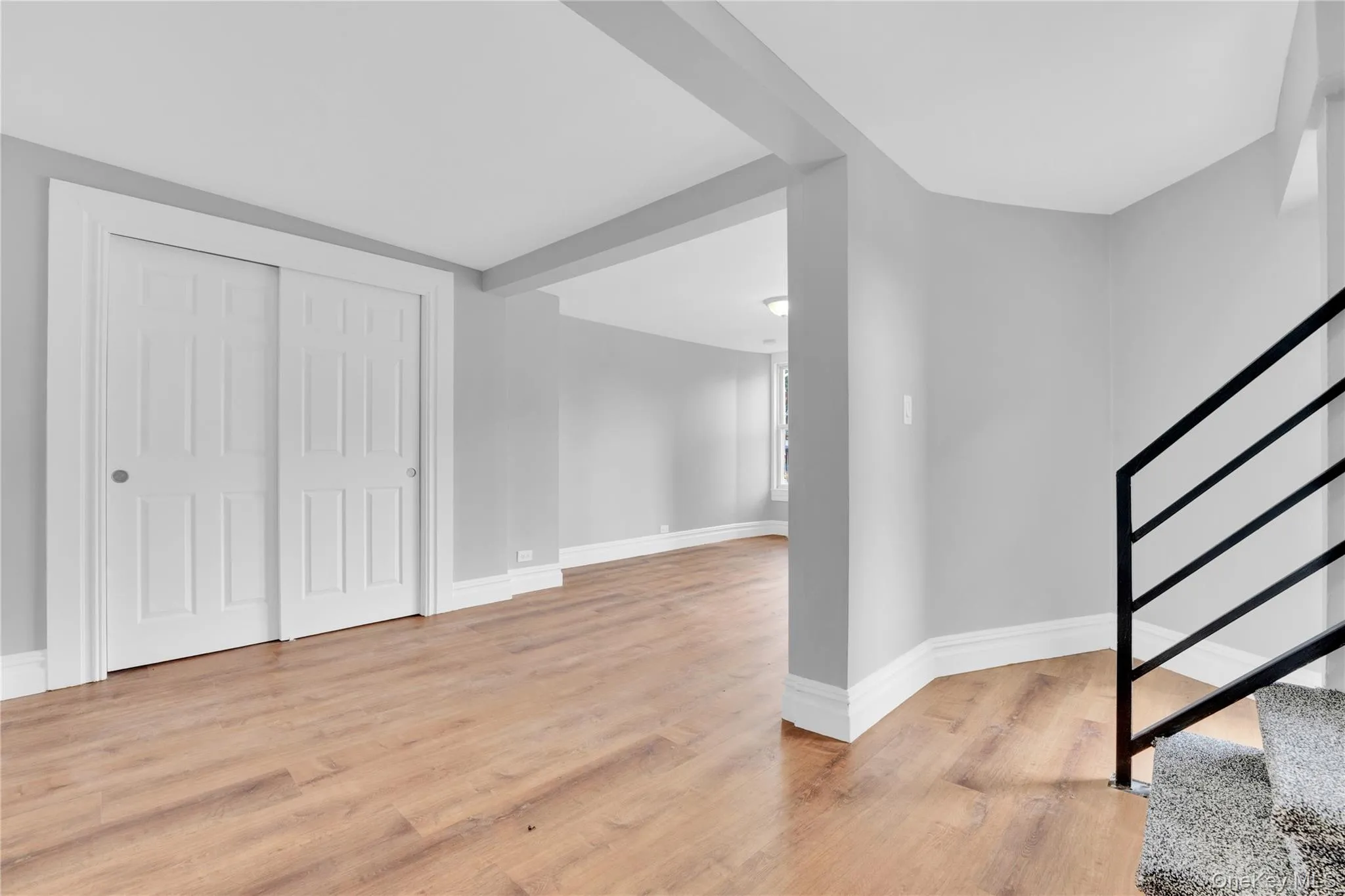 Foyer entrance with stairs and light wood-type flooring Foyer entrance with stairs and light wood-type flooring