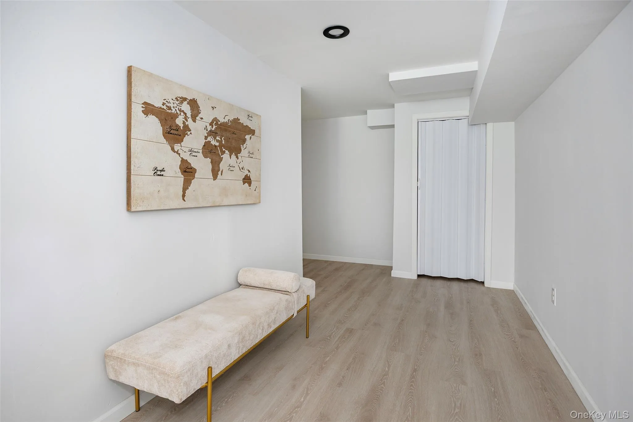 Living area with wood finished floors and baseboards Living area with wood finished floors and baseboards