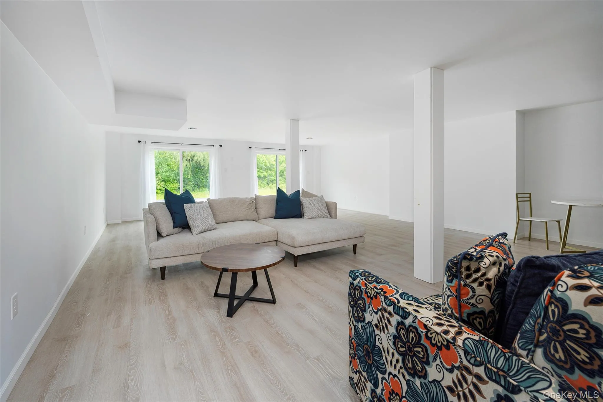 Living room with wood finished floors and baseboards Living room with wood finished floors and baseboards