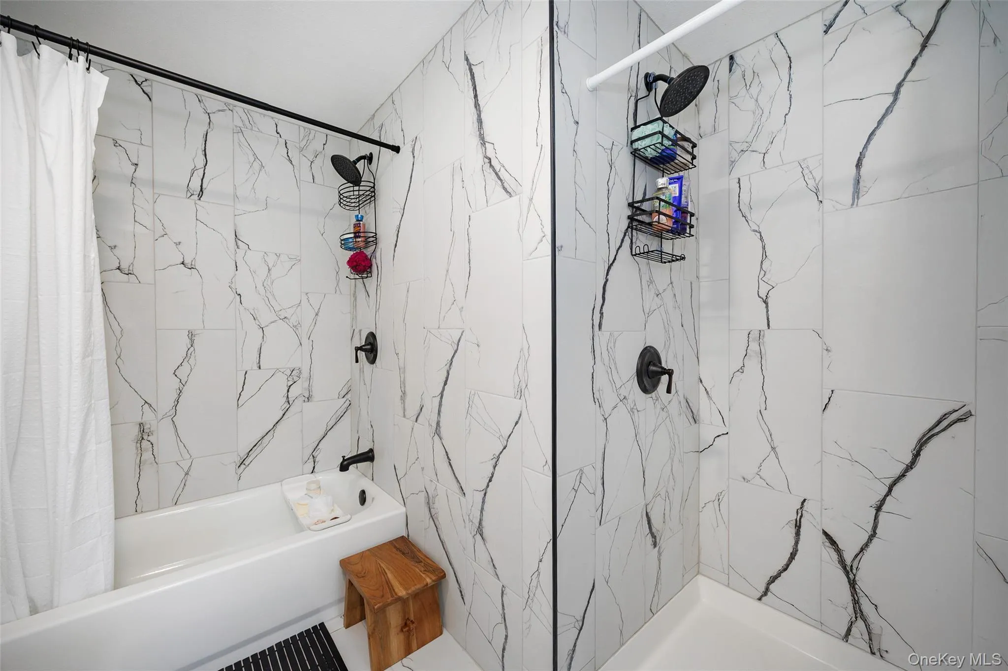 Bathroom with shower / bath combo with shower curtain Bathroom with shower / bath combo with shower curtain
