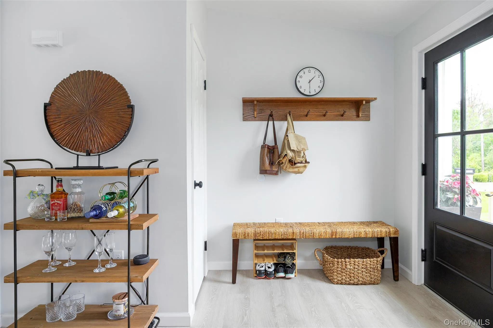 Mudroom with wood finished floors and baseboards Mudroom with wood finished floors and baseboards