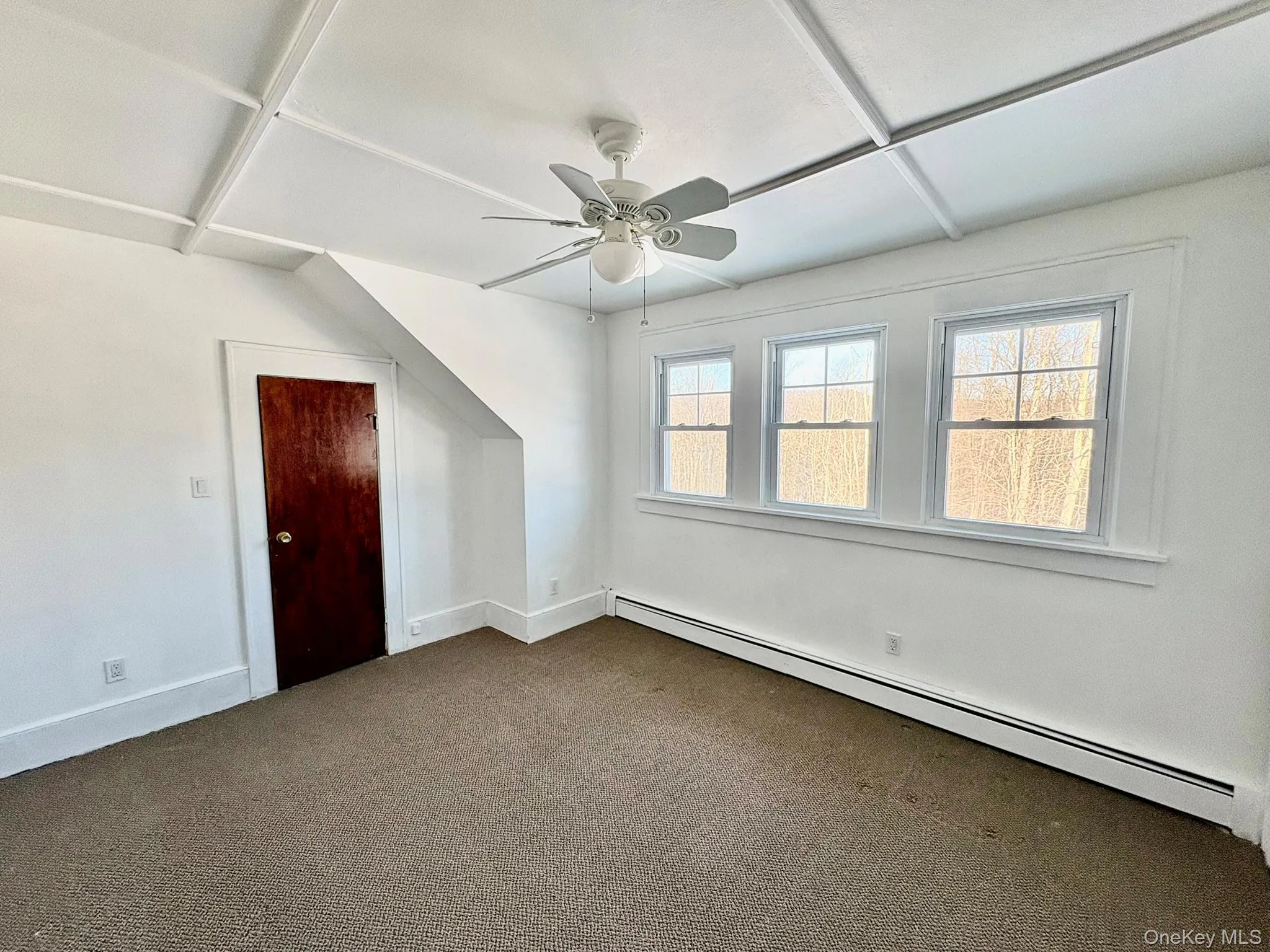 Bonus room featuring a baseboard heating unit, carpet floors, and a ceiling fan Bonus room featuring a baseboard heating unit, carpet floors, and a ceiling fan