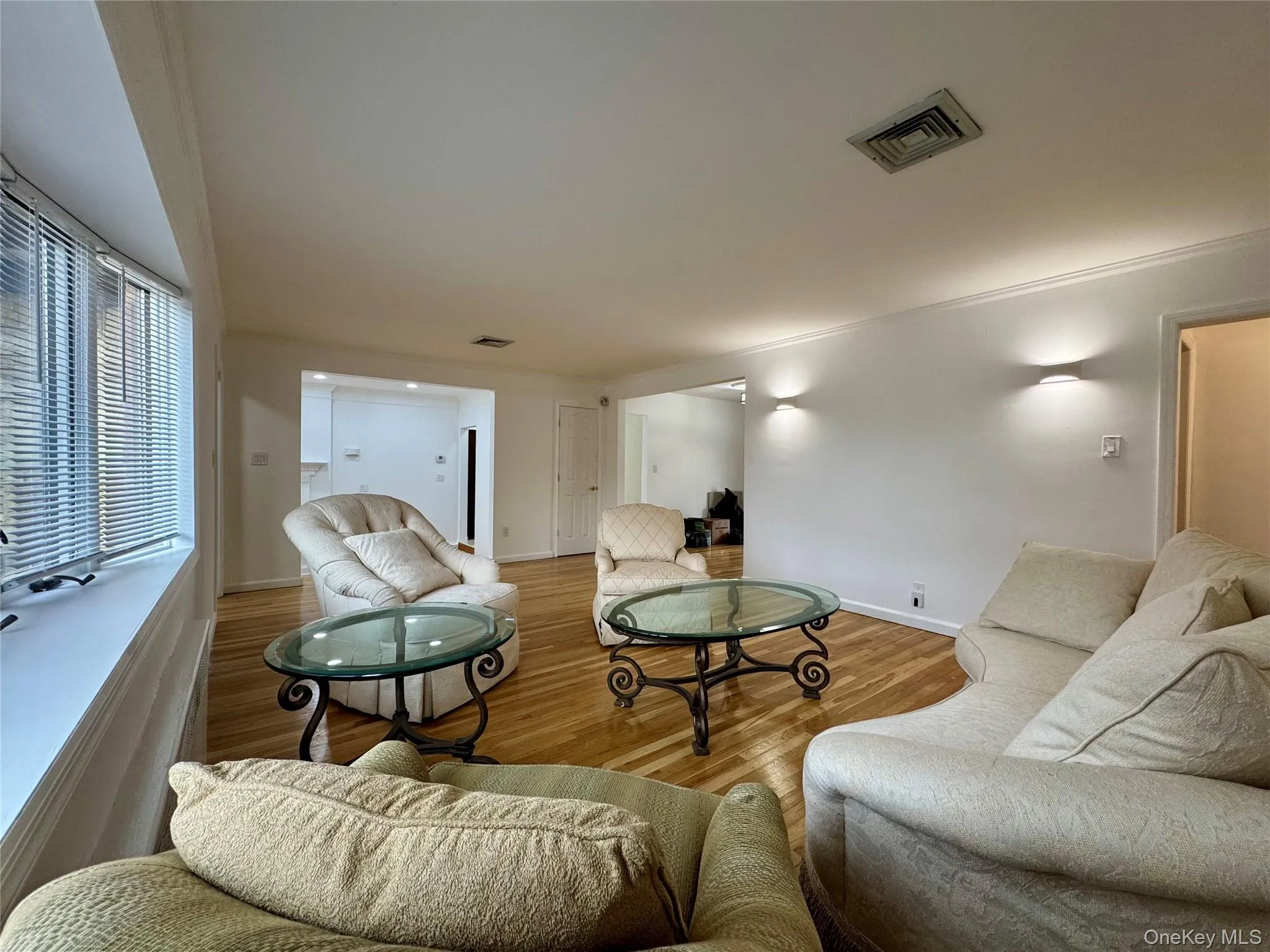 Living area featuring wood finished floors and baseboards Living area featuring wood finished floors and baseboards