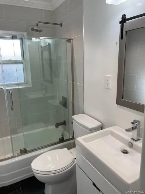 Full bath with combined bath / shower with glass door and vanity Full bath with combined bath / shower with glass door and vanity