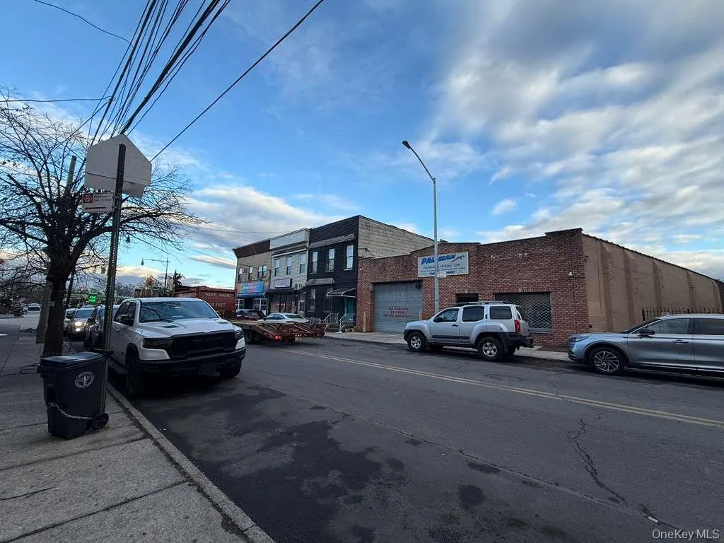 View of asphalt street with street lights, sidewalks, and curbs View of asphalt street with street lights, sidewalks, and curbs