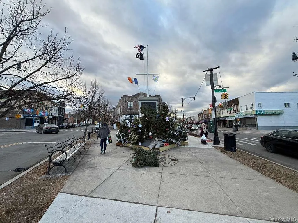 View of asphalt street with sidewalks and curbs View of asphalt street with sidewalks and curbs