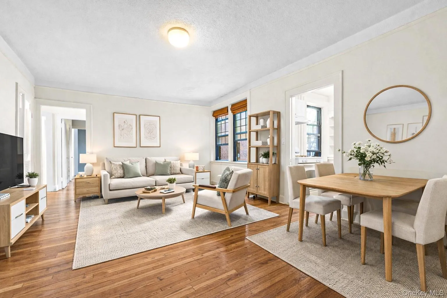 Living area featuring hardwood / wood-style floors and a textured ceiling Living area featuring hardwood / wood-style floors and a textured ceiling