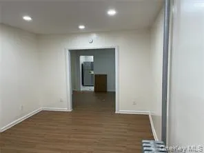 Hall with dark wood finished floors and recessed lighting Hall with dark wood finished floors and recessed lighting