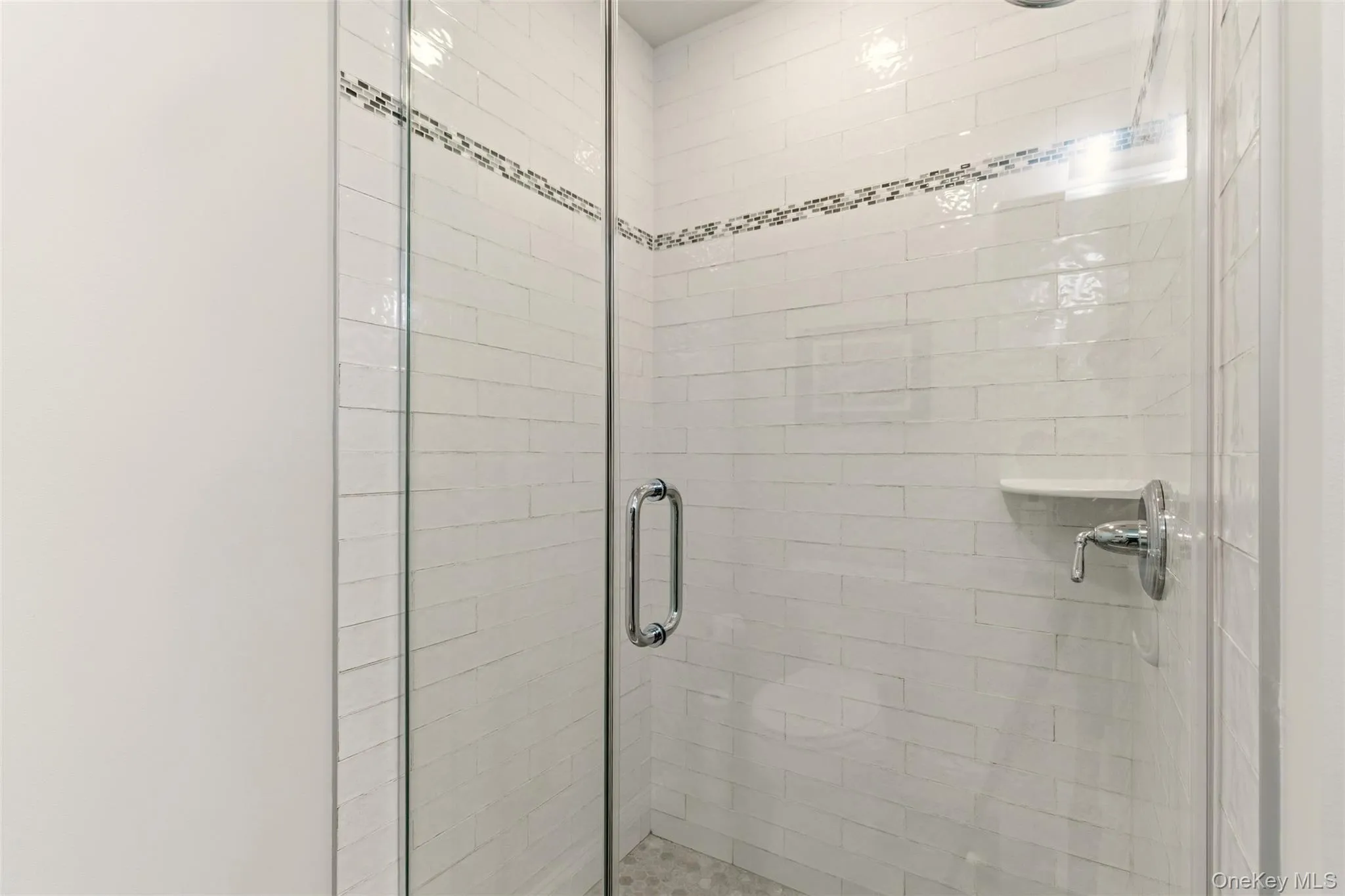 Bathroom featuring a shower stall Bathroom featuring a shower stall