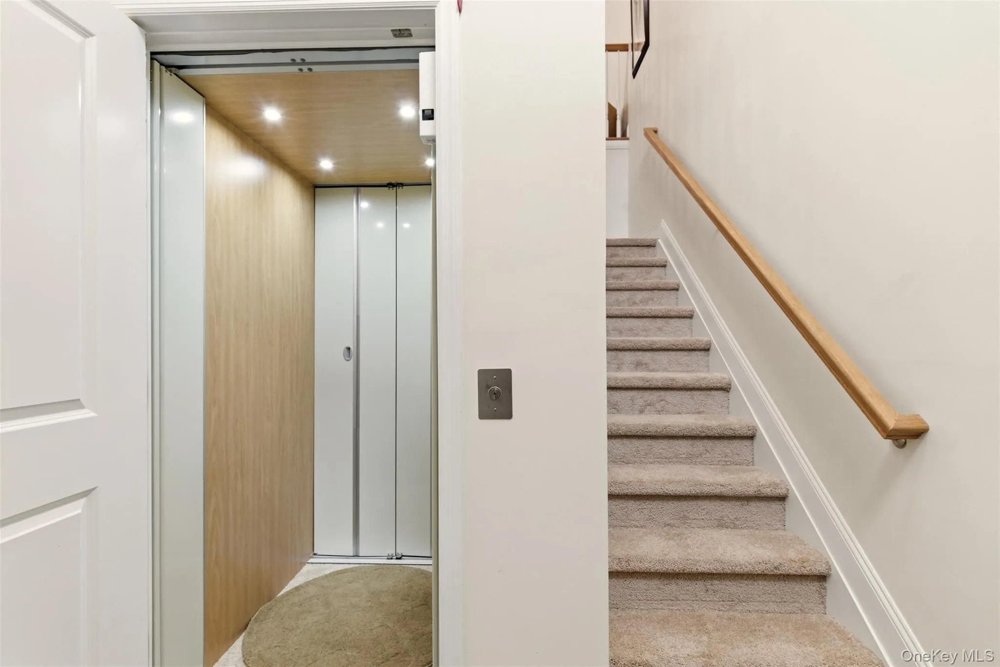 Walk into the foyer with either stairs or the elevator option. Walk into the foyer with either stairs or the elevator option.