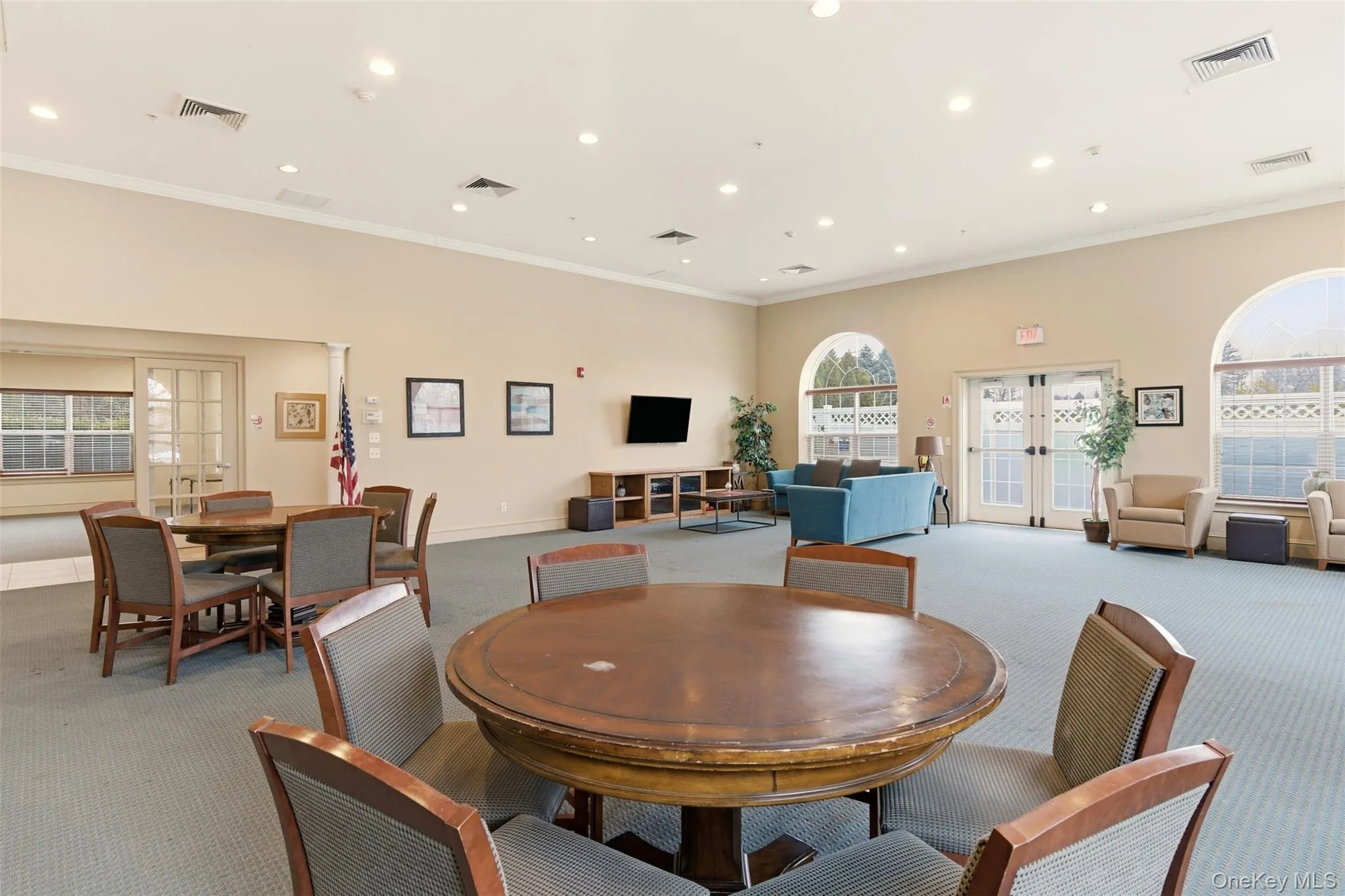 Dining space featuring french doors, carpet floors, recessed lighting, ornamental molding, and plenty of natural light Dining space featuring french doors, carpet floors, recessed lighting, ornamental molding, and plenty of natural light
