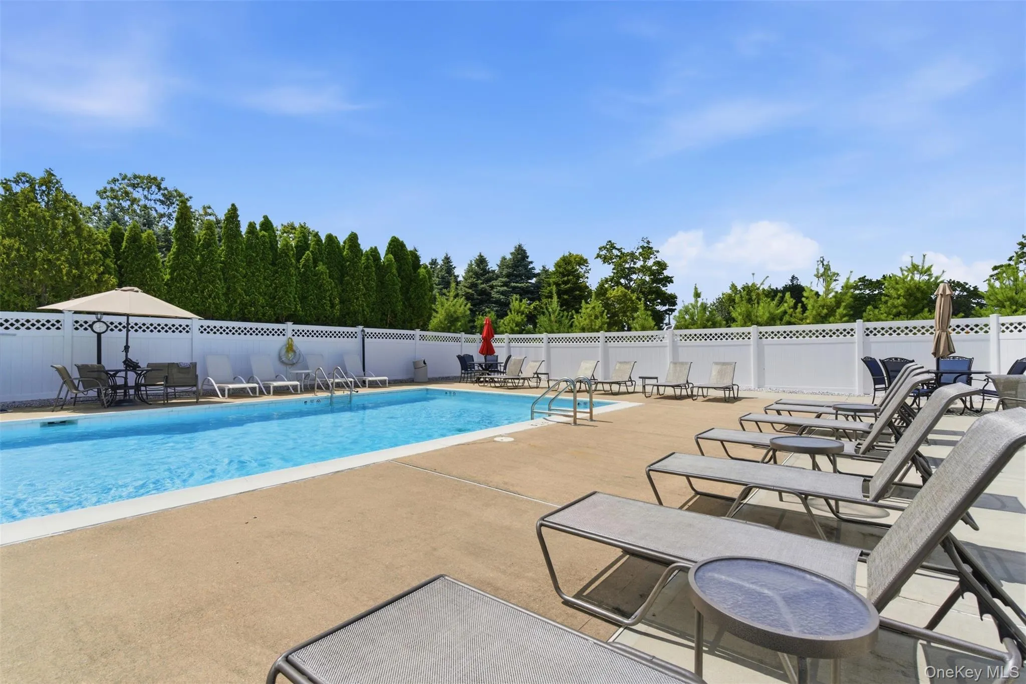 Community pool with a patio Community pool with a patio