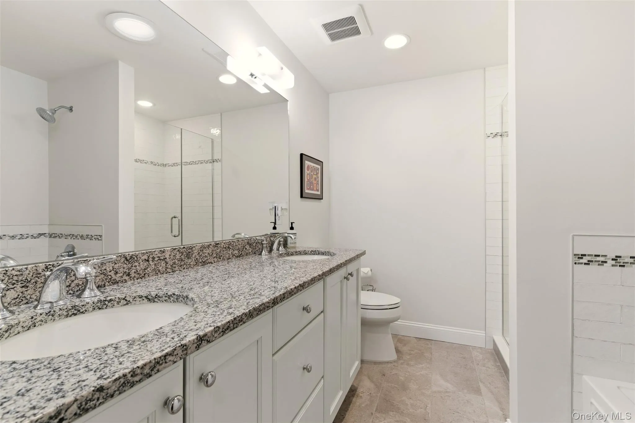 Full bathroom with double vanity, a shower stall, a tub, and recessed lighting Full bathroom with double vanity, a shower stall, a tub, and recessed lighting