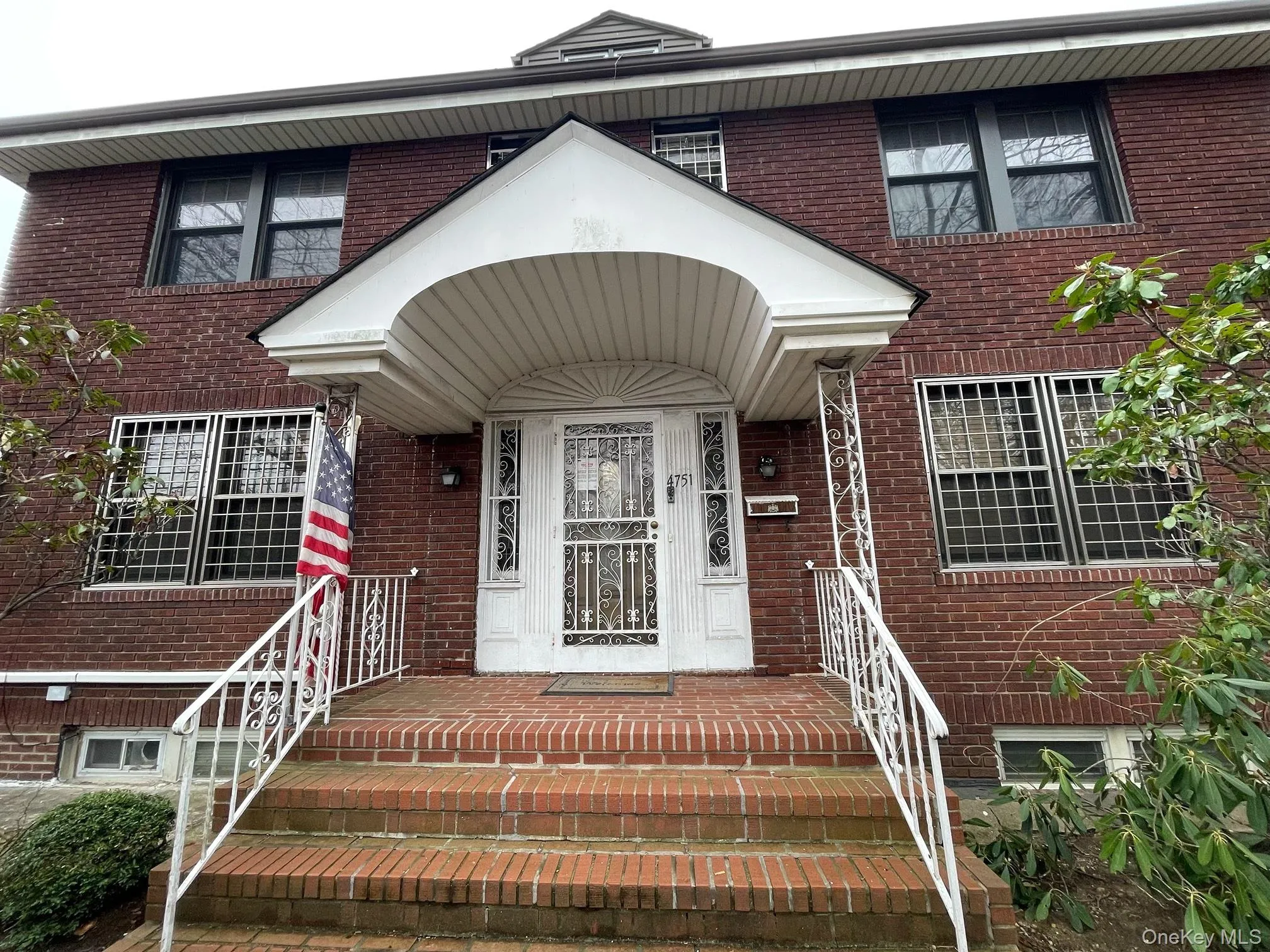 Doorway to property featuring brick siding Doorway to property featuring brick siding