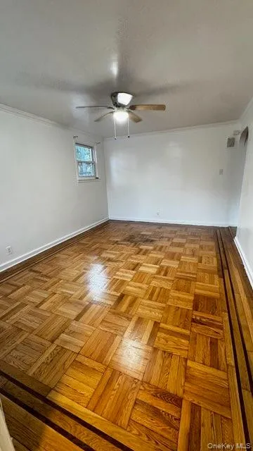 Unfurnished room with crown molding and ceiling fan Unfurnished room with crown molding and ceiling fan