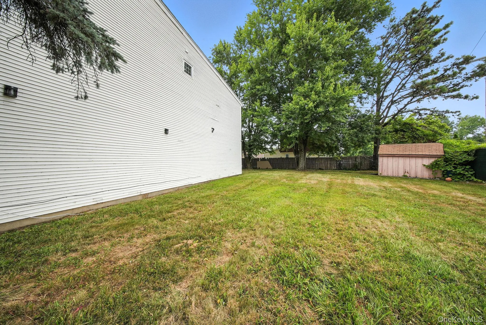 View of yard featuring a shed View of yard featuring a shed