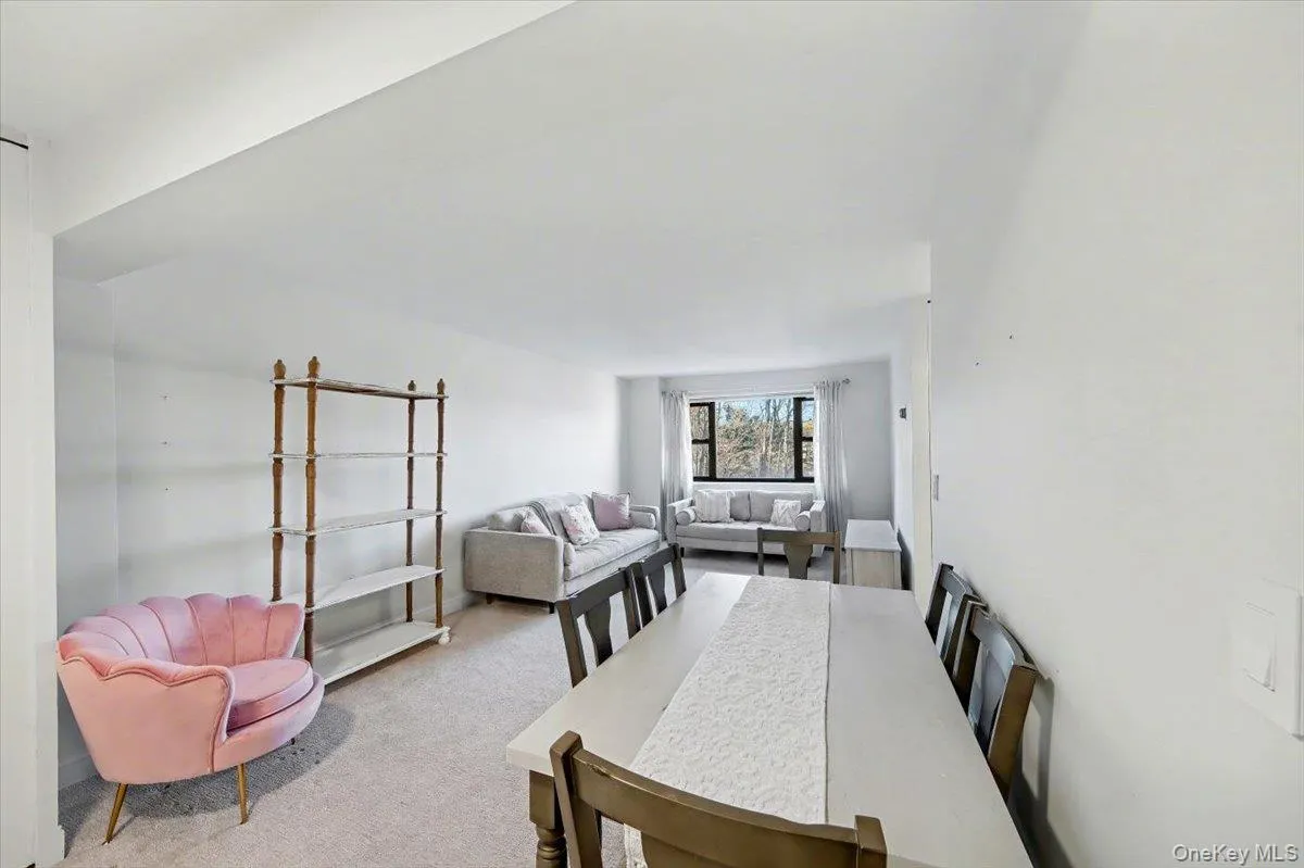 Dining room featuring carpet Dining room featuring carpet