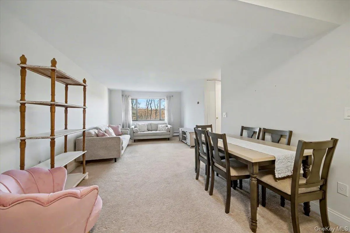 Dining area with light colored carpet Dining area with light colored carpet