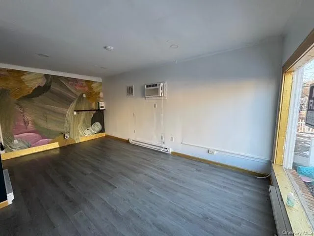 Other view of the interior of the store with plumbing in place for sink, wall unit A/C and high hat ceiling lights. Other view of the interior of the store with plumbing in place for sink, wall unit A/C and high hat ceiling lights.