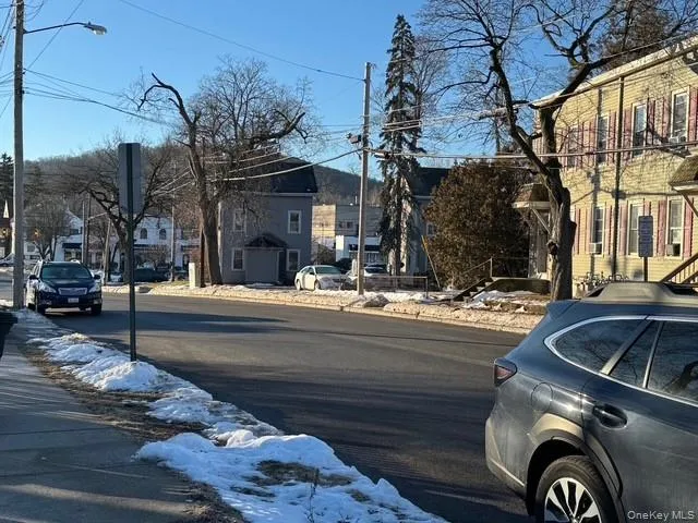 View of the road, sidewalks and street parking. View of the road, sidewalks and street parking.
