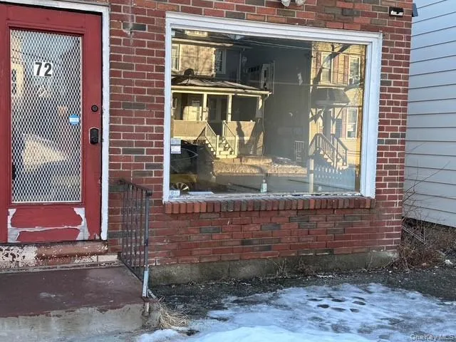 Doorway to the store featuring brick siding. Doorway to the store featuring brick siding.