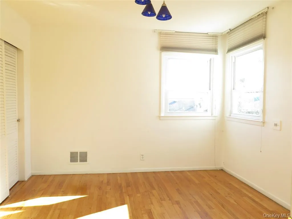 Unfurnished bedroom with light wood-type flooring, a ceiling fan, and a closet Unfurnished bedroom with light wood-type flooring, a ceiling fan, and a closet