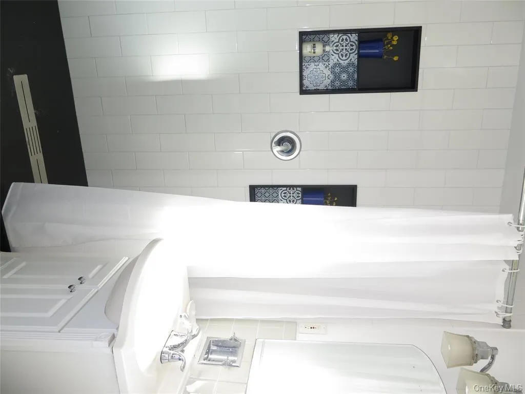 Bathroom with tiled shower and vanity Bathroom with tiled shower and vanity