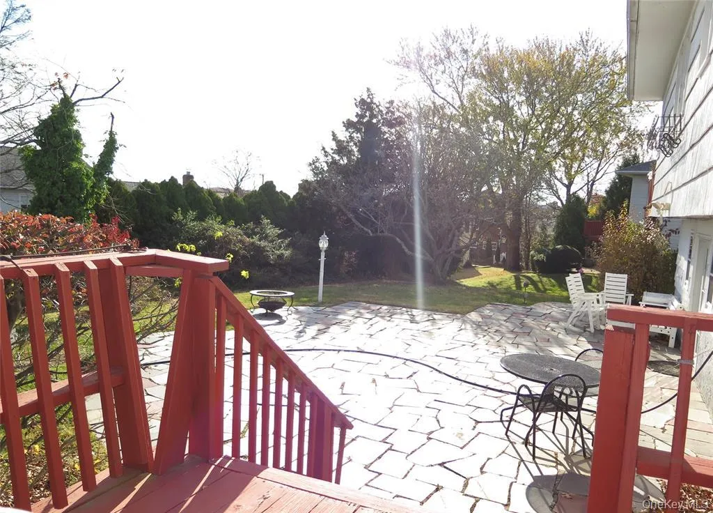 Deck with a patio and outdoor dining area Deck with a patio and outdoor dining area