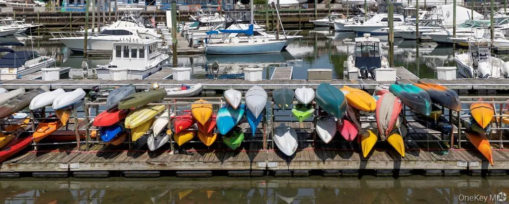 Dock with a water view and view of marina Dock with a water view and view of marina
