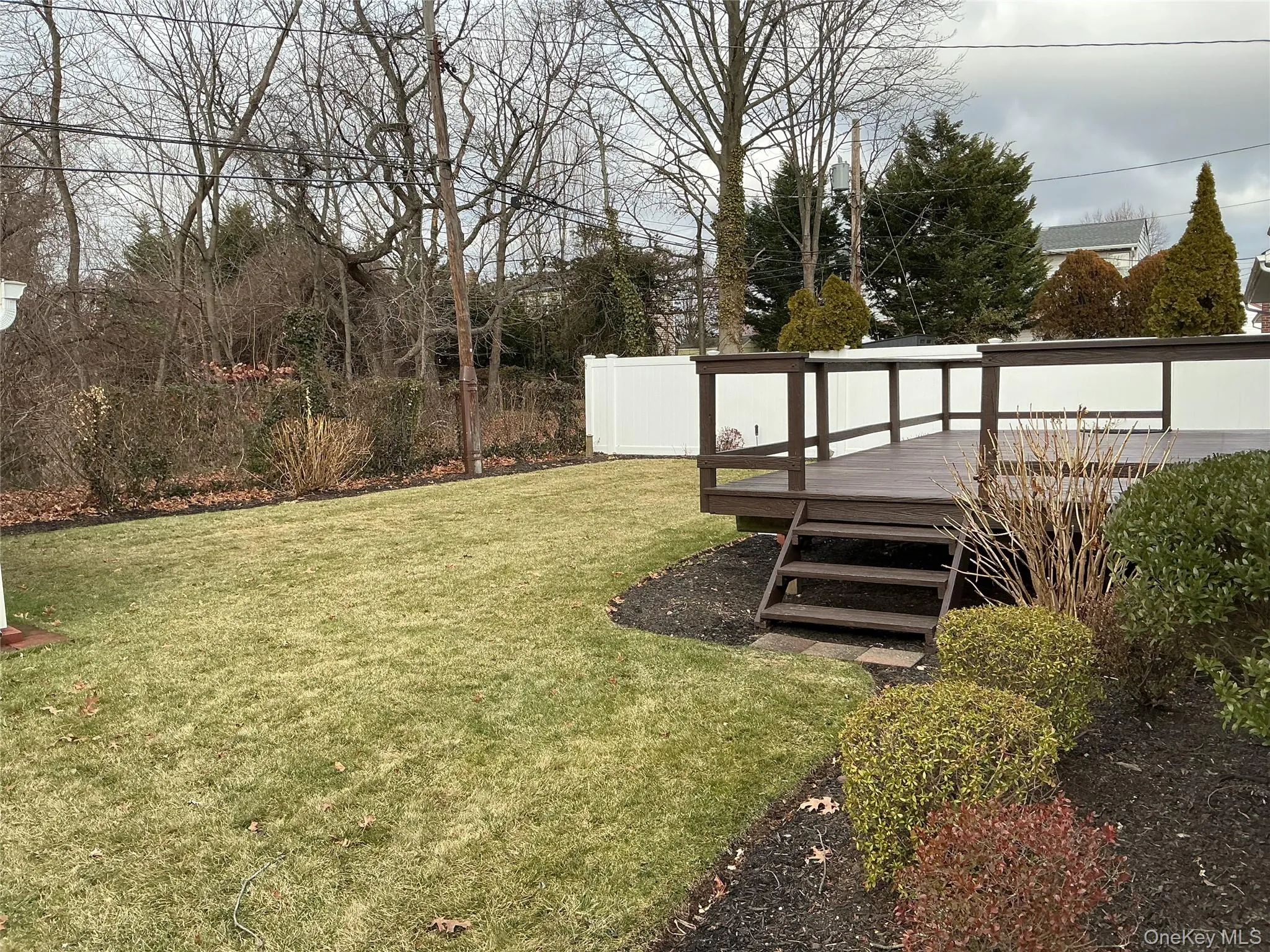 View of yard featuring a wooden deck View of yard featuring a wooden deck