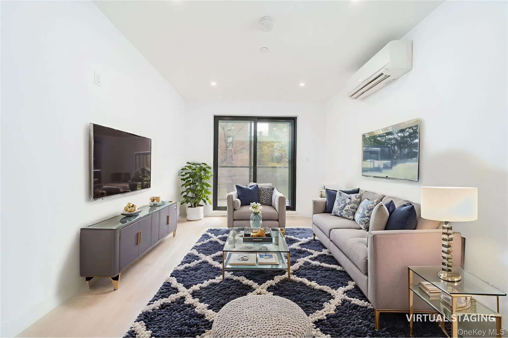 Living room with an AC wall unit and light wood-style floors Living room with an AC wall unit and light wood-style floors