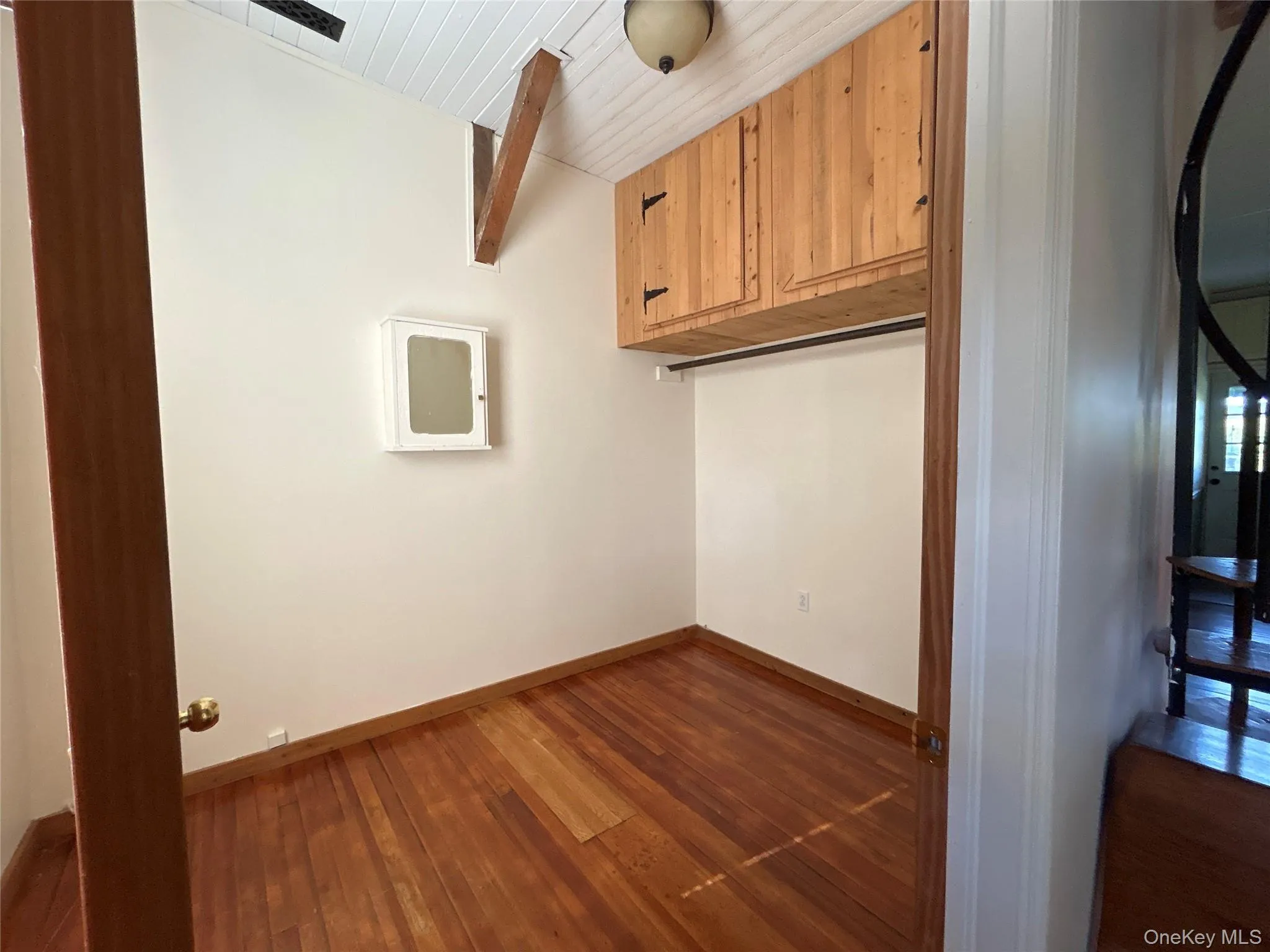 Laundry area with dark wood finished floors and wood ceiling Laundry area with dark wood finished floors and wood ceiling