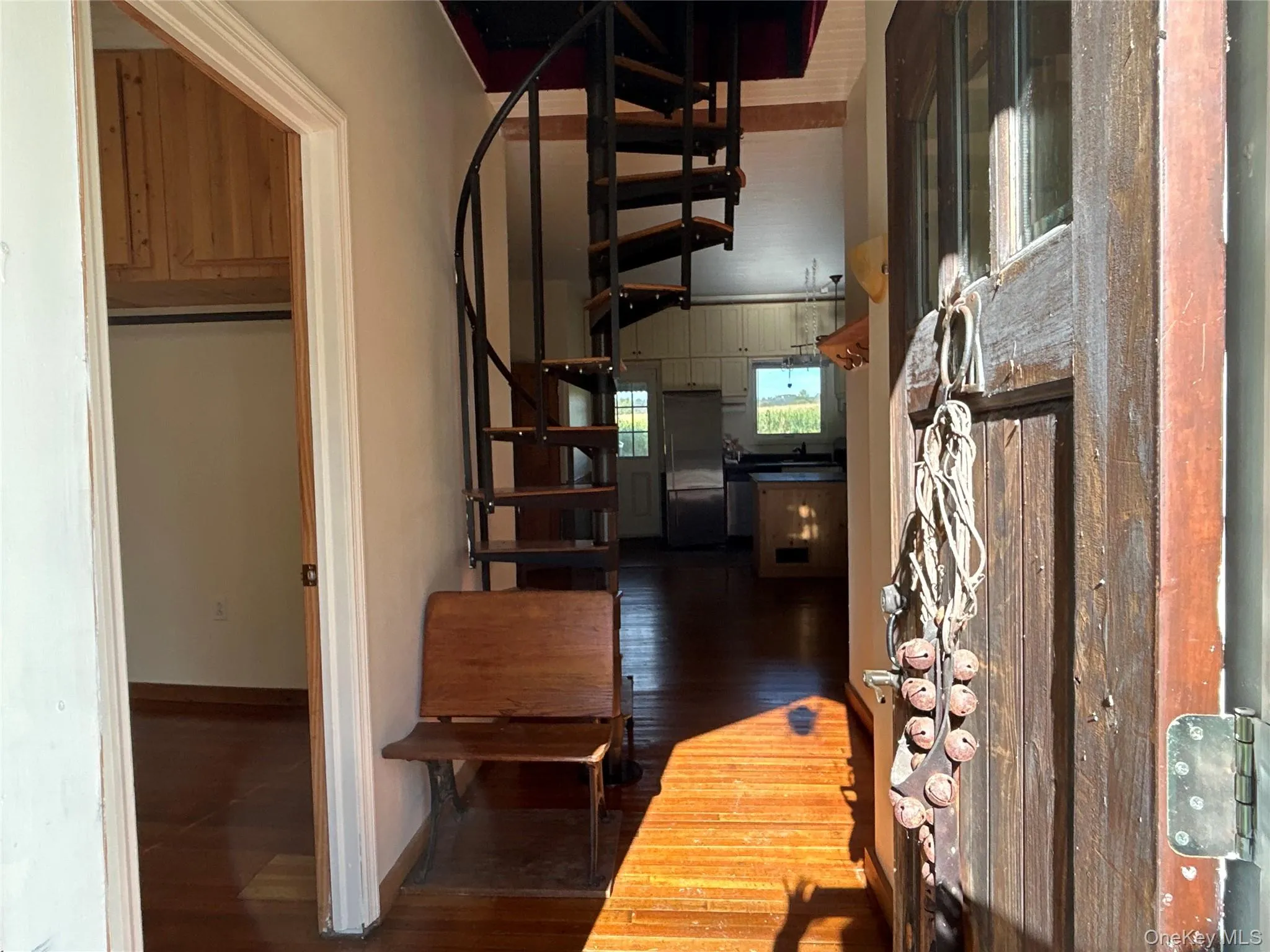 Corridor with dark wood finished floors and baseboards Corridor with dark wood finished floors and baseboards