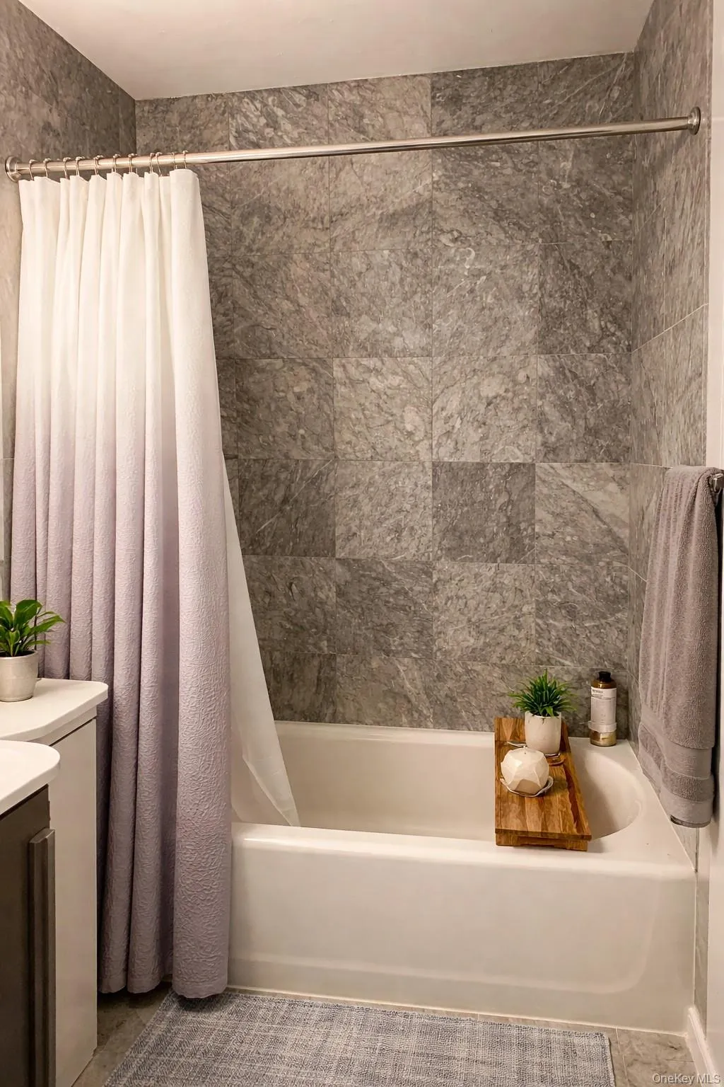 Full bath featuring shower / bathtub combination with curtain and vanity Full bath featuring shower / bathtub combination with curtain and vanity