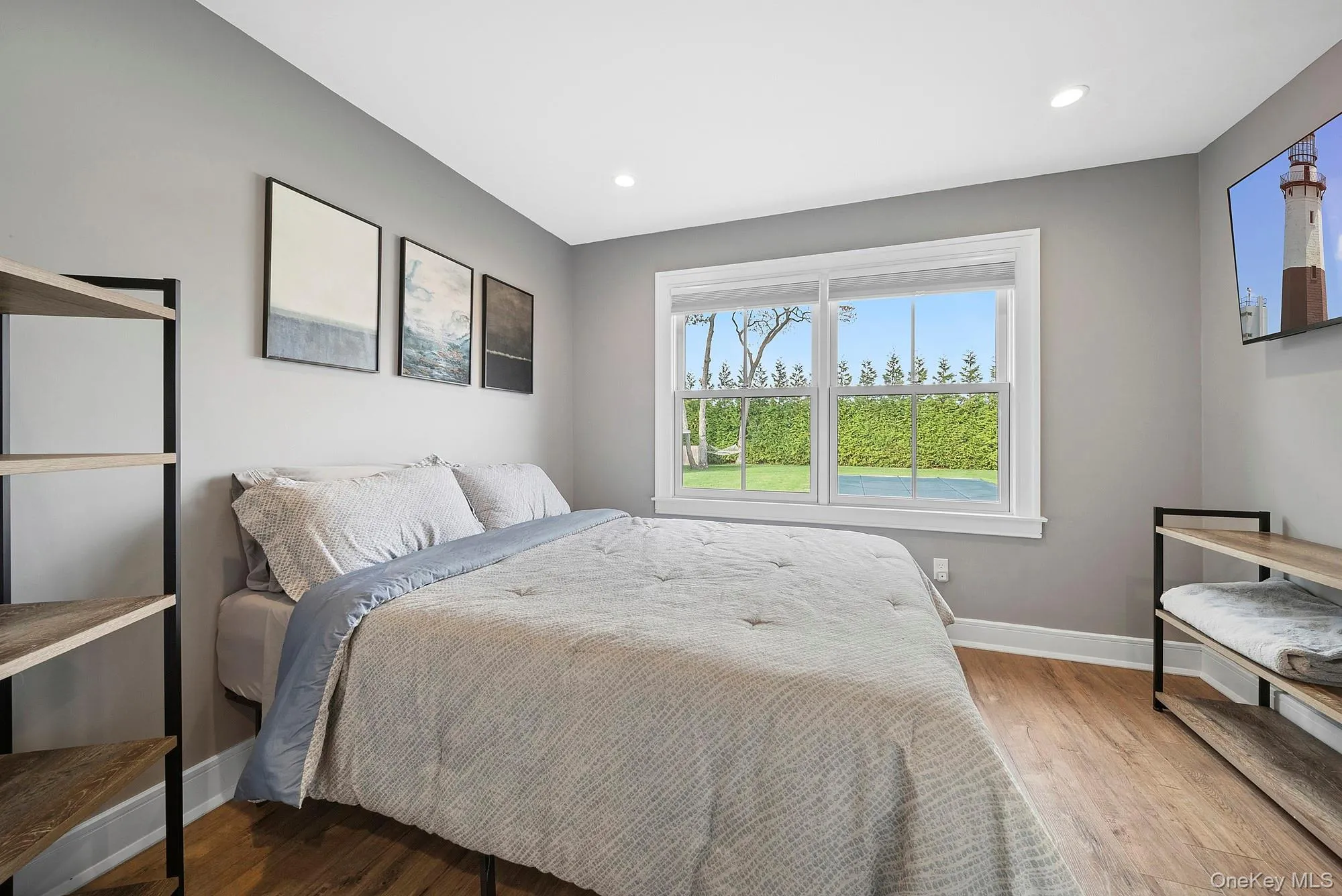 Bedroom with wood finished floors and recessed lighting Bedroom with wood finished floors and recessed lighting