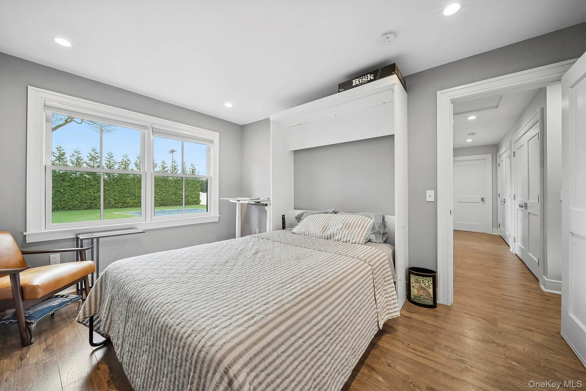 Bedroom featuring dark wood-type flooring and recessed lighting Bedroom featuring dark wood-type flooring and recessed lighting