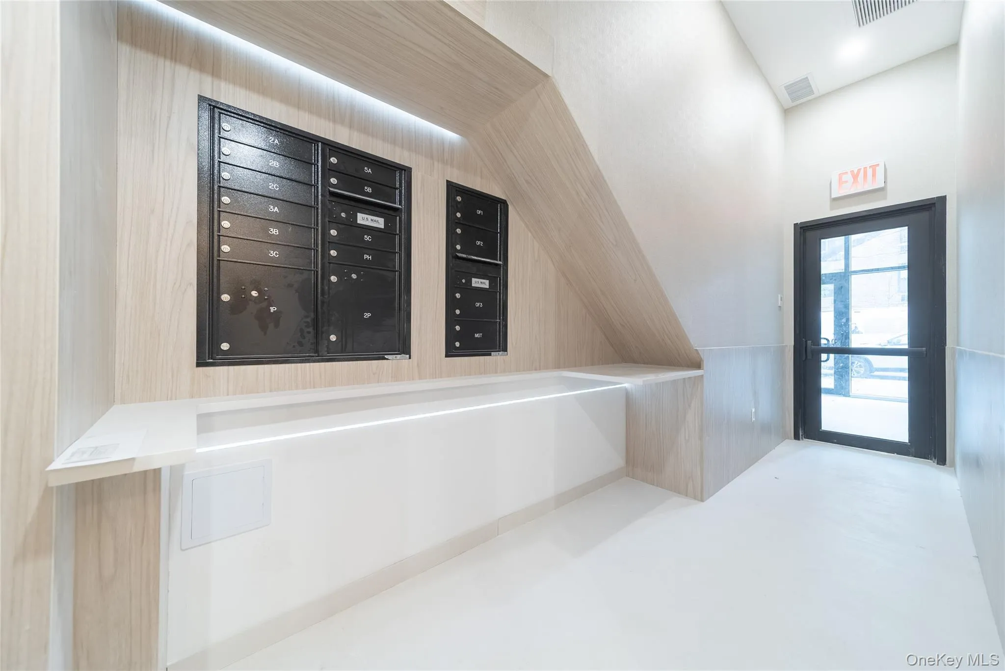 View of community with mail area and wainscoting View of community with mail area and wainscoting