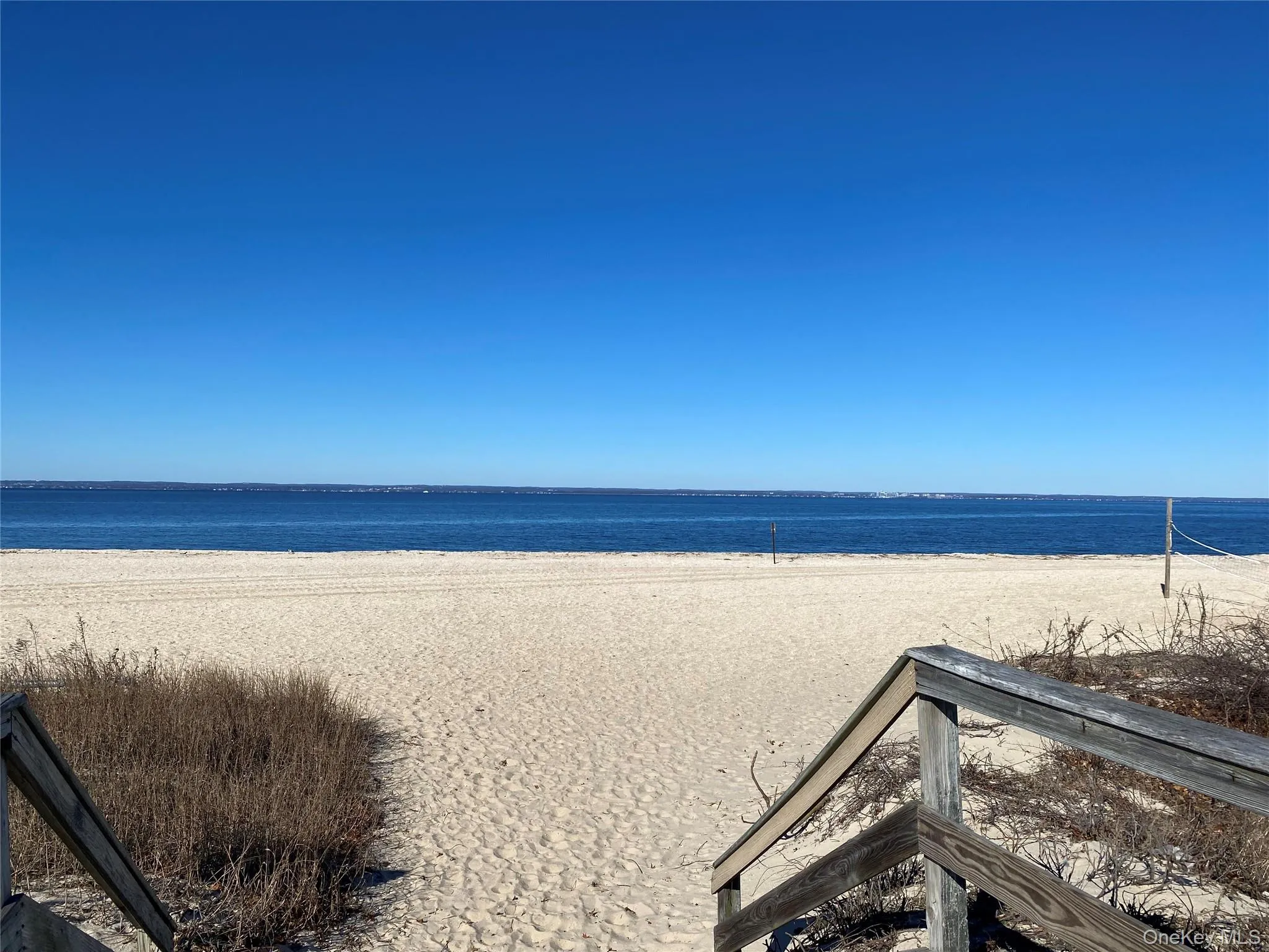 Water view featuring nearby beach Water view featuring nearby beach