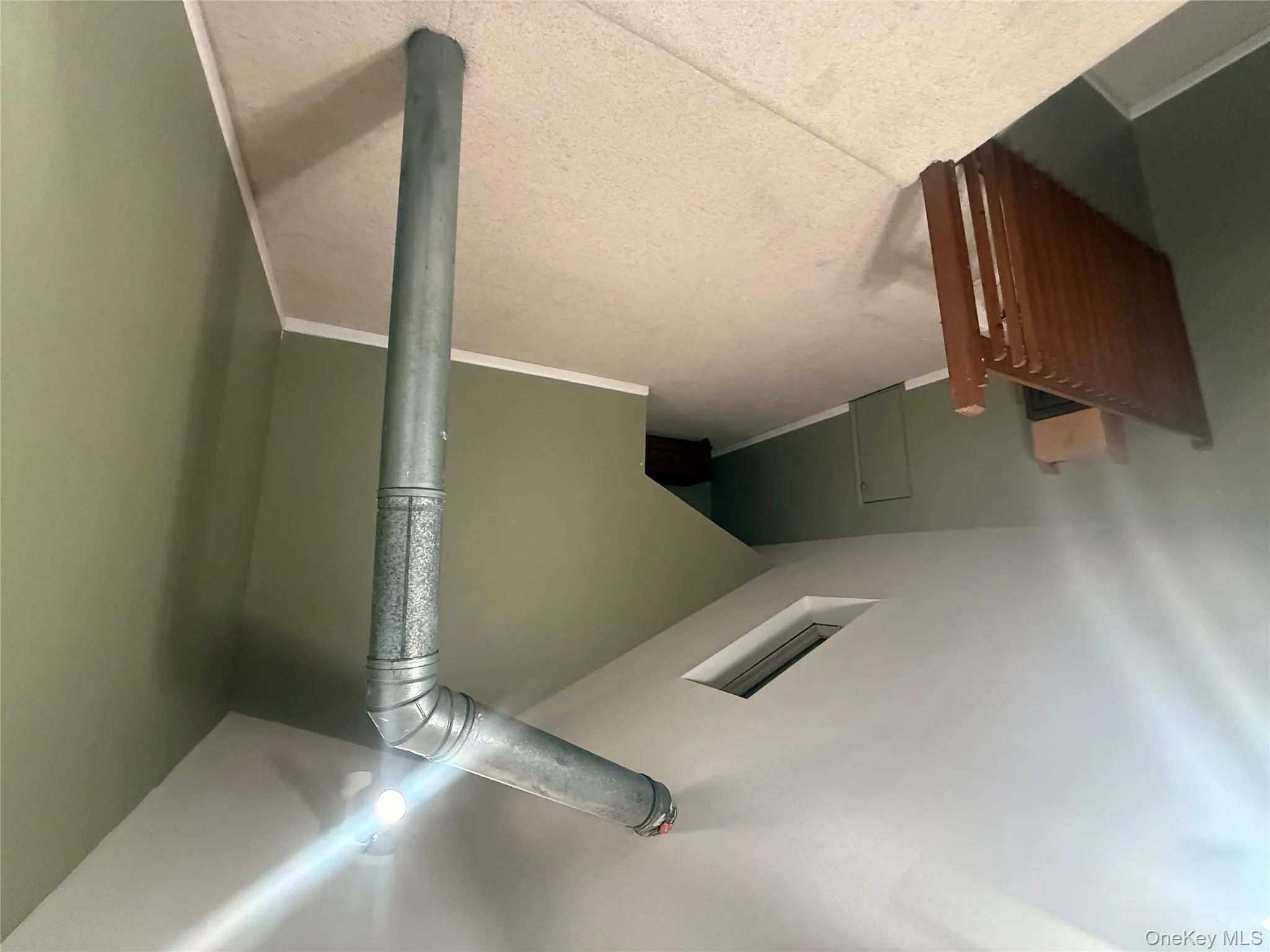 Unique finished attic space with carpeting, a skylight for natural light, and versatile potential for a home office or creative studio. Unique finished attic space with carpeting, a skylight for natural light, and versatile potential for a home office or creative studio.