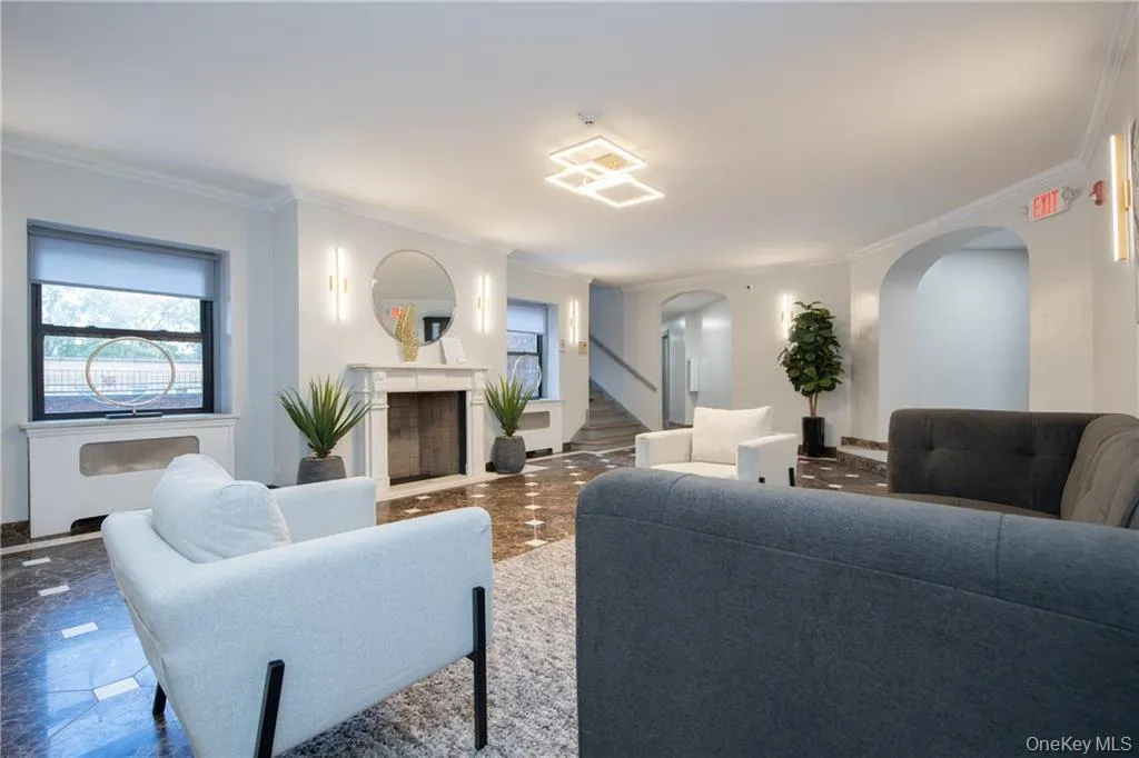 Living room featuring ornamental molding Living room featuring ornamental molding