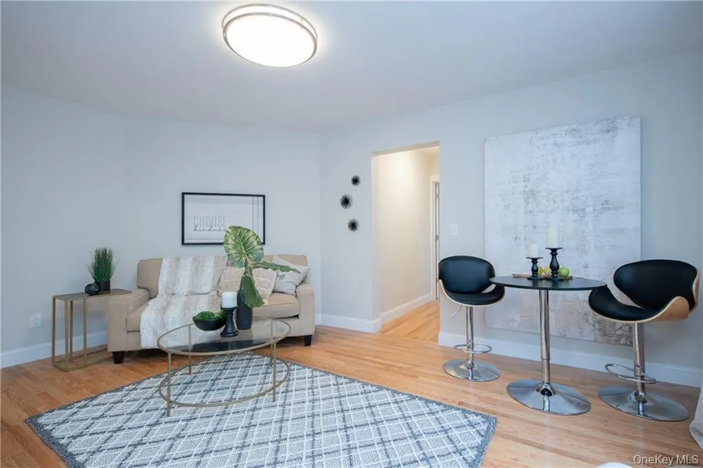 Sitting room featuring wood-type flooring Sitting room featuring wood-type flooring