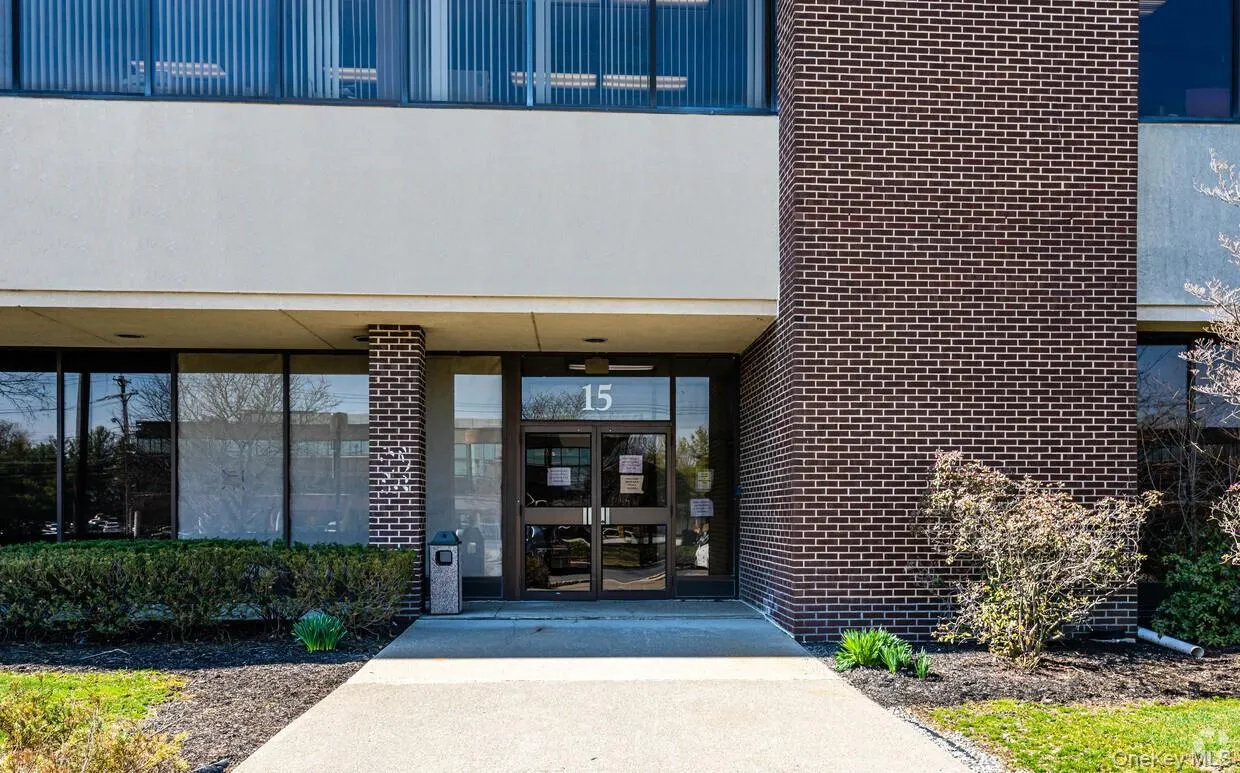 View of exterior entry featuring brick siding and french doors View of exterior entry featuring brick siding and french doors
