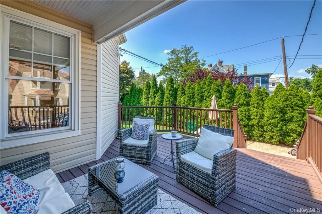 Wooden deck featuring an outdoor hangout area Wooden deck featuring an outdoor hangout area