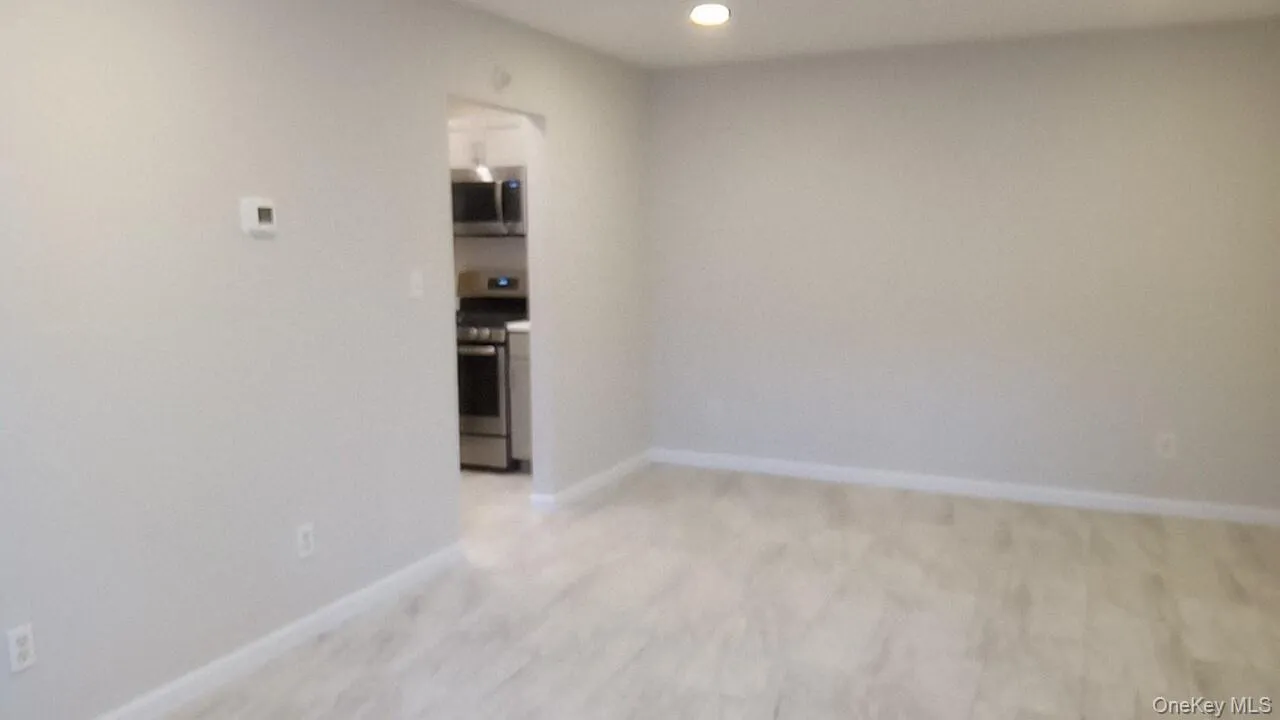 Spare room with light carpet and recessed lighting Spare room with light carpet and recessed lighting