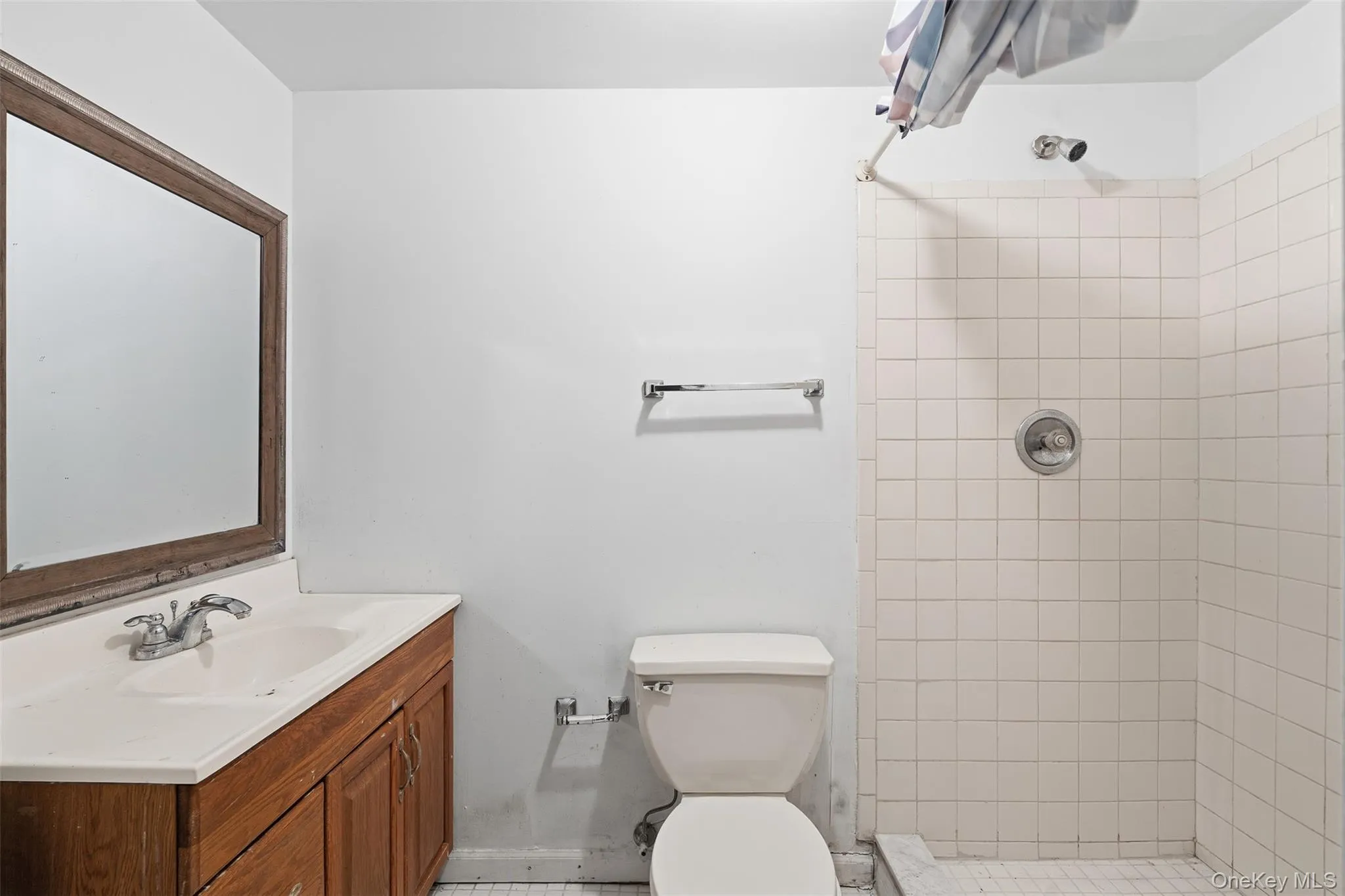 Bathroom featuring vanity and a stall shower Bathroom featuring vanity and a stall shower