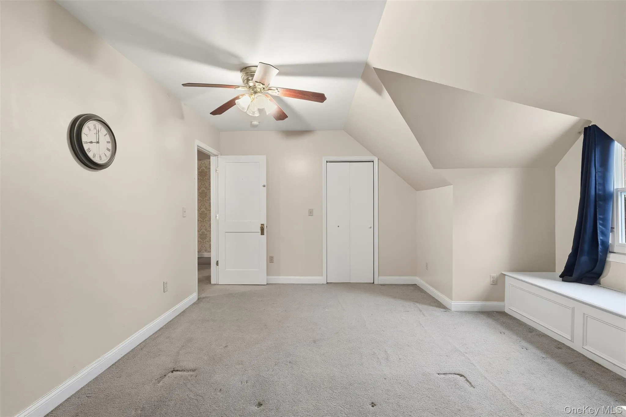 Bonus room with light colored carpet, a ceiling fan, and vaulted ceiling Bonus room with light colored carpet, a ceiling fan, and vaulted ceiling