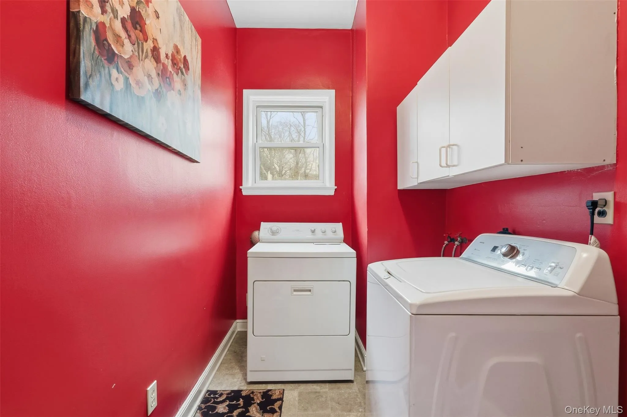 Laundry area featuring cabinet space and washing machine and dryer Laundry area featuring cabinet space and washing machine and dryer