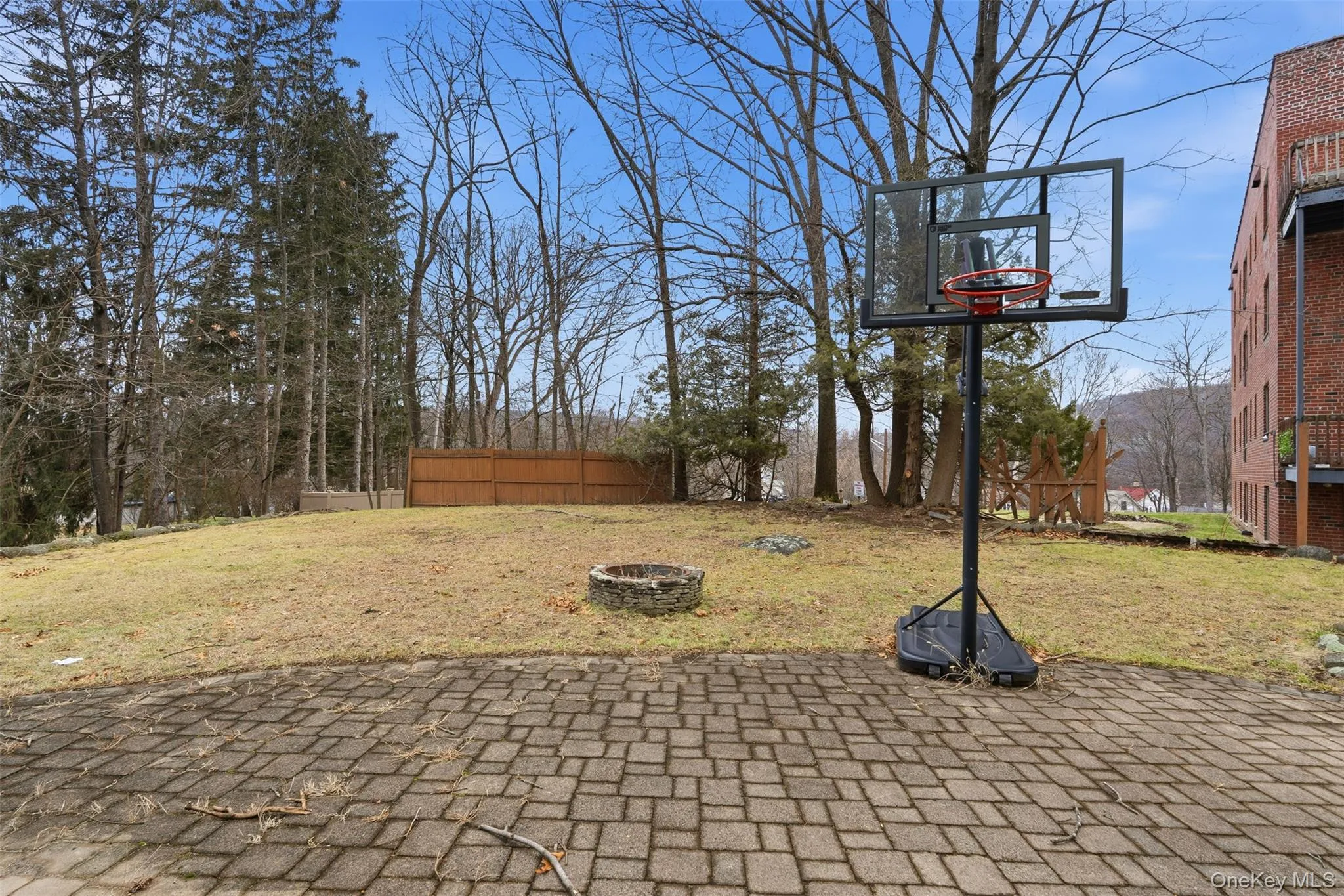 View of basketball court with a patio area View of basketball court with a patio area